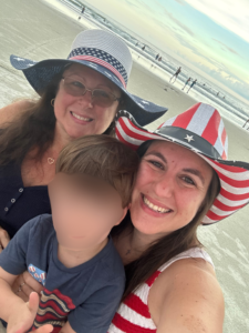Picture of Shannon and me with my grandson (whose face is blurred)